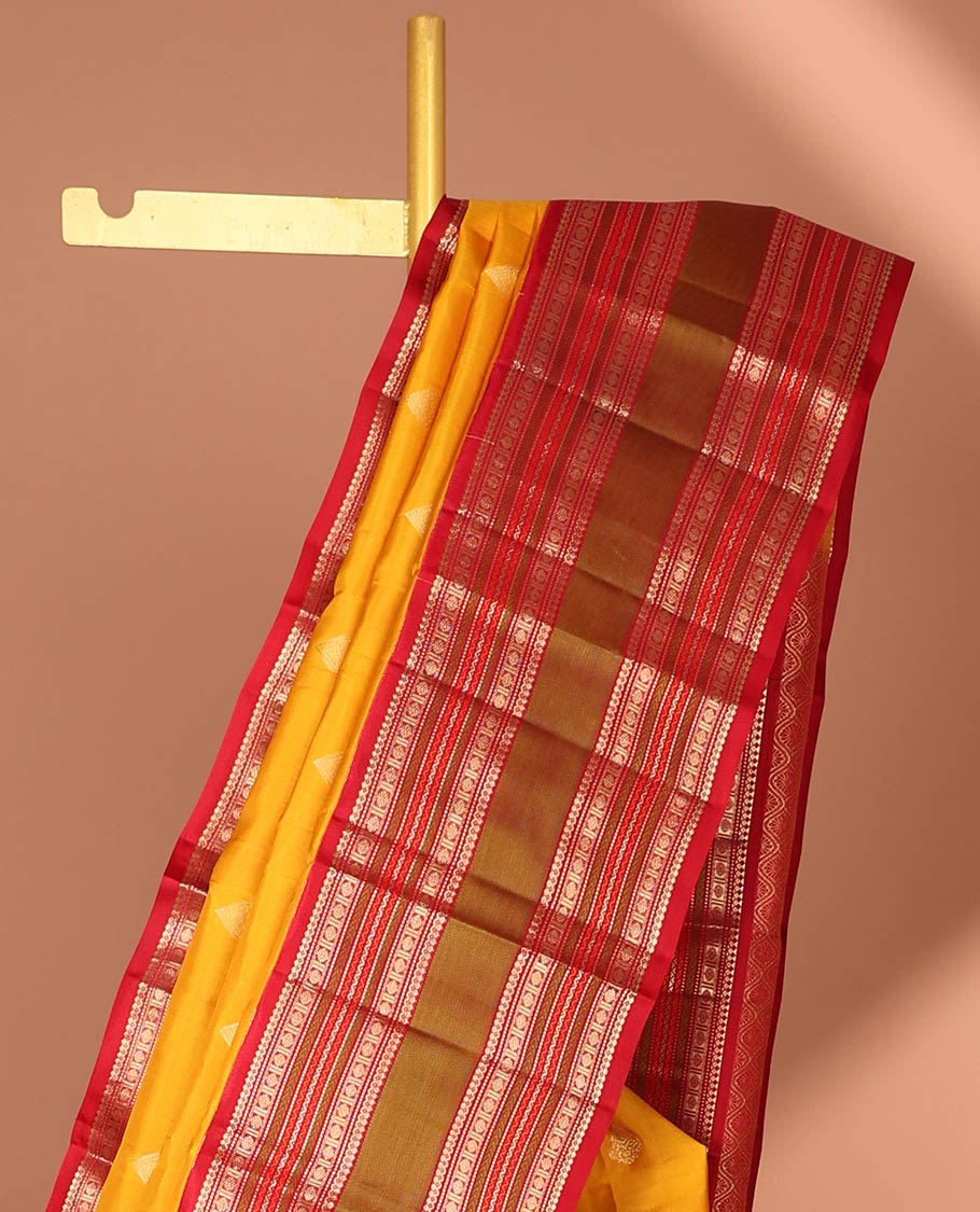 Yellow leaf buttas silk saree with contrast border of thilakam mokku, muthu, paun design & pallu of jaal design