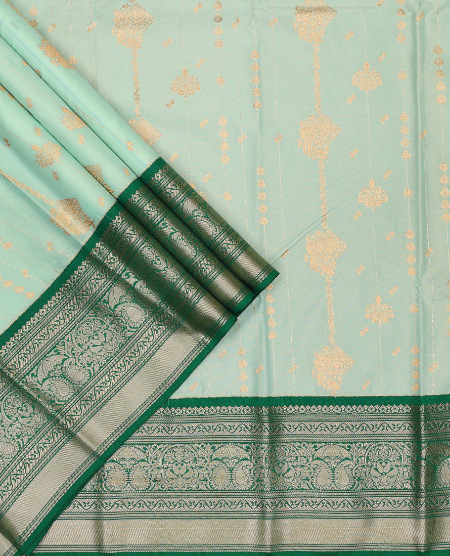 Pista green art silk pavadai set, zari design with contrast traditional zari bordered skirt and a contrast zari design blouse