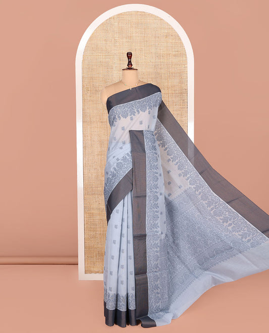 Grey Semi-Silk Cotton Saree, Detailed with Buttas All Over Its Body, Complemented by a Contrast Border, Pallu Steeped with Floral Designs, and Paired with a Matching Blouse