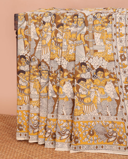 Yellow-mustrad human motifs machine-printed kalamkari cotton saree, peacock printed border & pallu of pichwai cow & Radha Krishna print