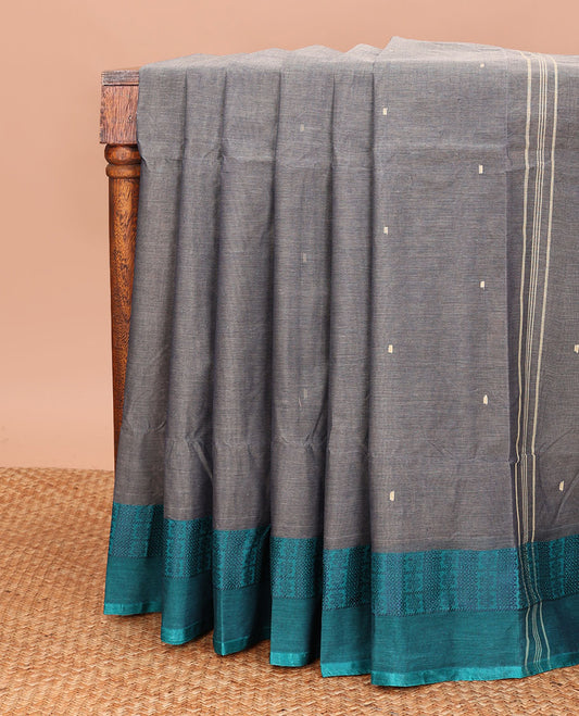 Grey Bengal Cotton Saree, Featuring Buttas All Over Its Body, Complemented by Contrast Thread Border of Floral and Peacock Eye Patterns, and Pallu Steeped with Stripes