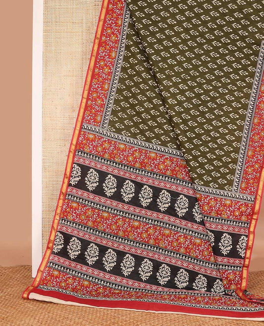 Green unique motifs printed mul mul cotton saree, contrast floral vine printed border, and pallu of floral print