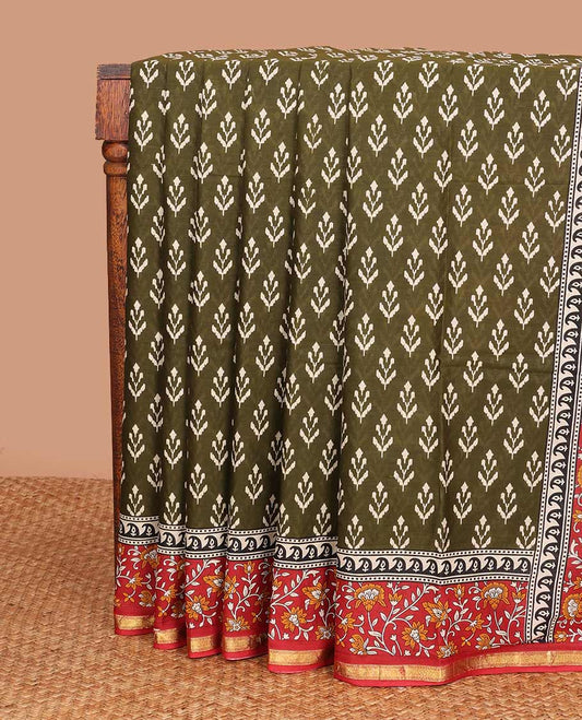 Green unique motifs printed mul mul cotton saree, contrast floral vine printed border, and pallu of floral print