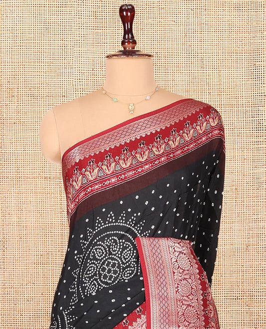 Black Dola Silk Saree, Detailed with Bandhani Dots on Its Body, Complemented by Contrast Border, Zari Striped  Pallu, and Paired with a Contrast Blouse