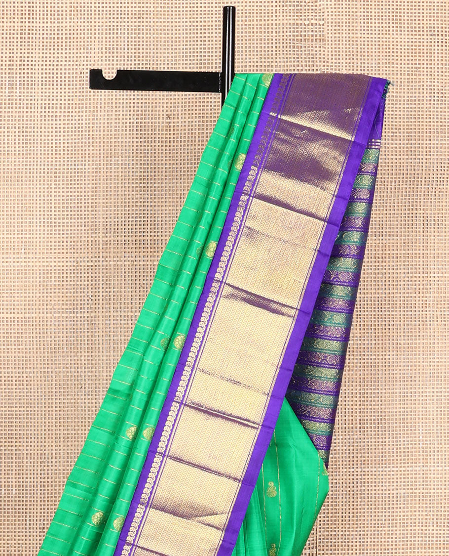 Green zari buttas Kanchipuram silksaree, contrast one-sided korvai border of manga mokku & vanki design & pallu of kodi visiry designs