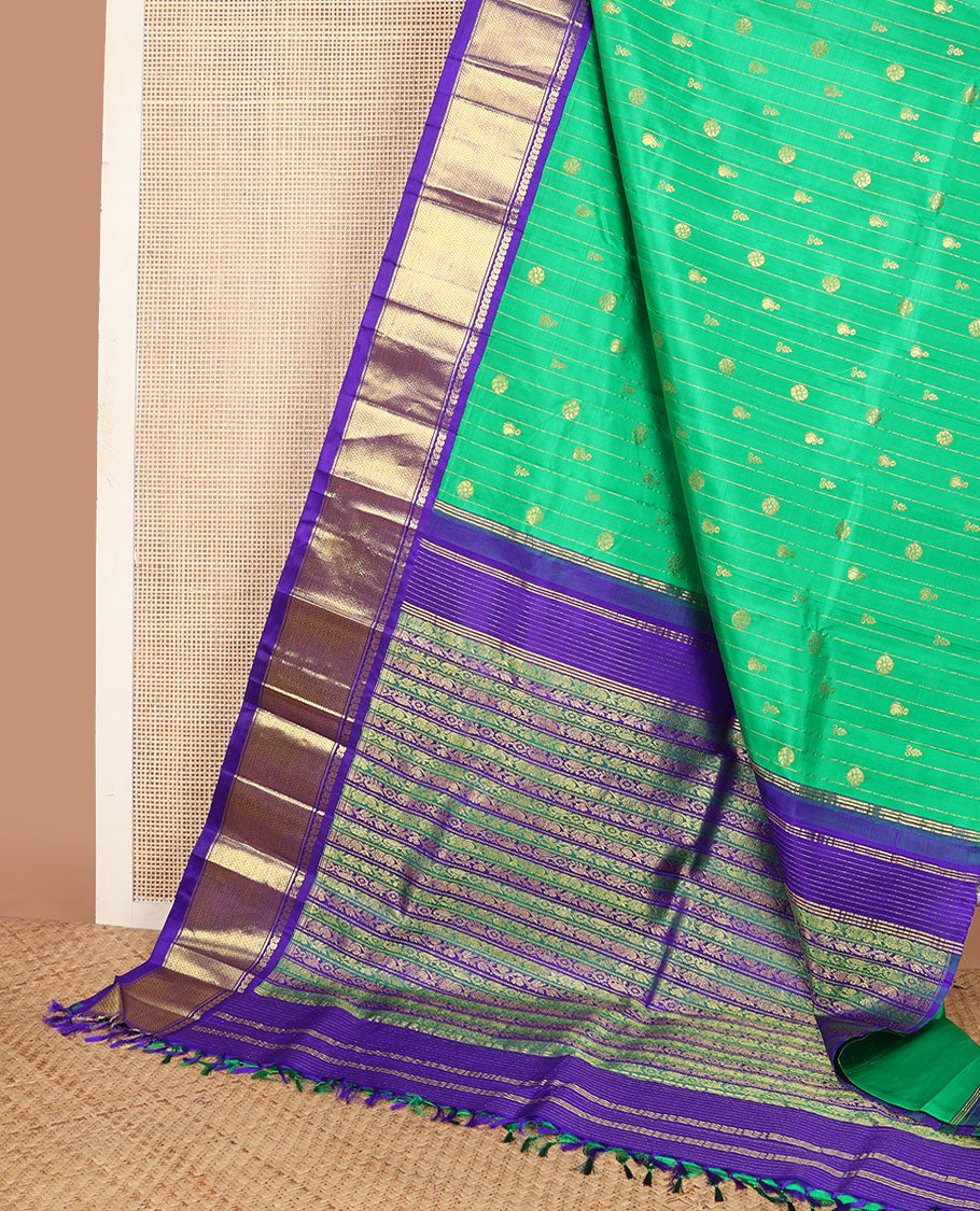 Green zari buttas Kanchipuram silksaree, contrast one-sided korvai border of manga mokku & vanki design & pallu of kodi visiry designs