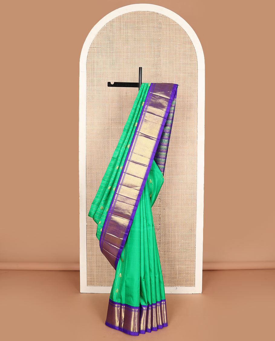 Green zari buttas Kanchipuram silksaree, contrast one-sided korvai border of manga mokku & vanki design & pallu of kodi visiry designs