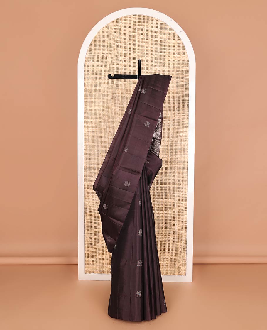 Borderless brown house-like zari buttas soft silk saree, zari pallu of human, and house motifs in zari