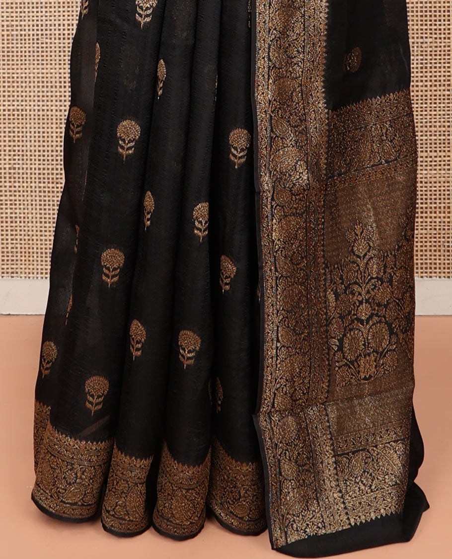 Black Matka Silk Saree, Mesmerized with Floral Buttas on Its Body, Highlighted by a Floral and Paisley Design Border, Pallu of Floral Designs, and Paired with a Matching Blouse