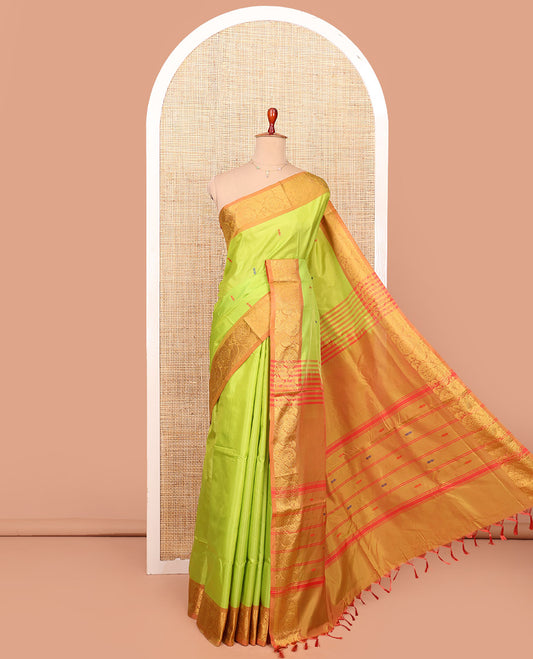 Green Banana Pith Saree Graced with Resham Buttas, Complemented by a Contrasting Border of Peacock Motifs, Pallu Steeped with Stripes and Resham Buttas, and Paired with a Contrast Blouse