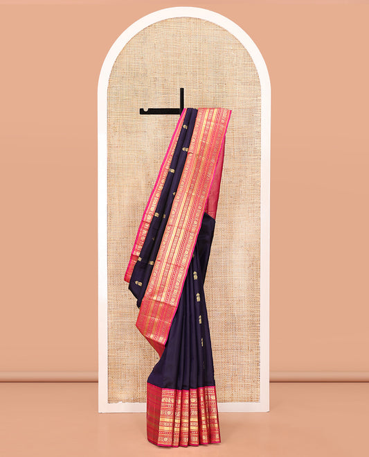 Blue Vasundhara Silk Saree, Embellished with Zari Buttas All Over Its Body, Complemented by a Contrast Border of Thilakam Mokku, Yaanai, Iruthalai Pakshi, and Kodi Visiry Designs, Grand Pallu, and Paired with a Contrast Blouse