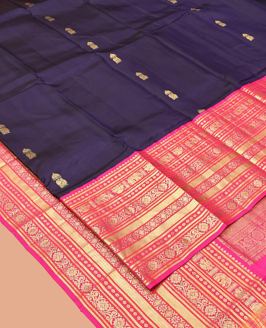 Blue Vasundhara Silk Saree, Embellished with Zari Buttas All Over Its Body, Complemented by a Contrast Border of Thilakam Mokku, Yaanai, Iruthalai Pakshi, and Kodi Visiry Designs, Grand Pallu, and Paired with a Contrast Blouse