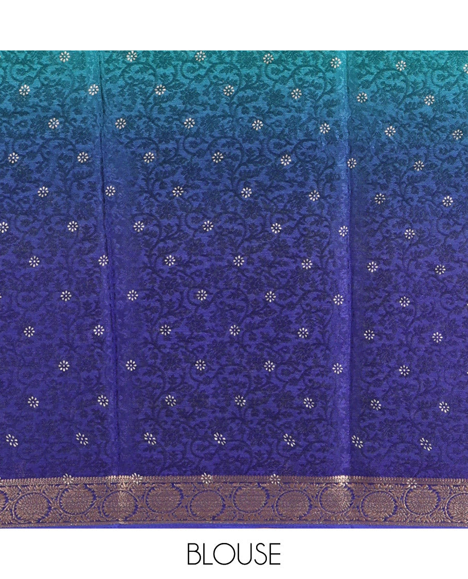 Green and Royal Blue Candy Chiffon Saree, Featuring Floral Vine Embossed, Buttas, and Ombre-Style Dyed on Its Body, Highlighted by Floral Creeper Zari Border, Intricately Designed Pallu, and Paired with a Contrast Blouse