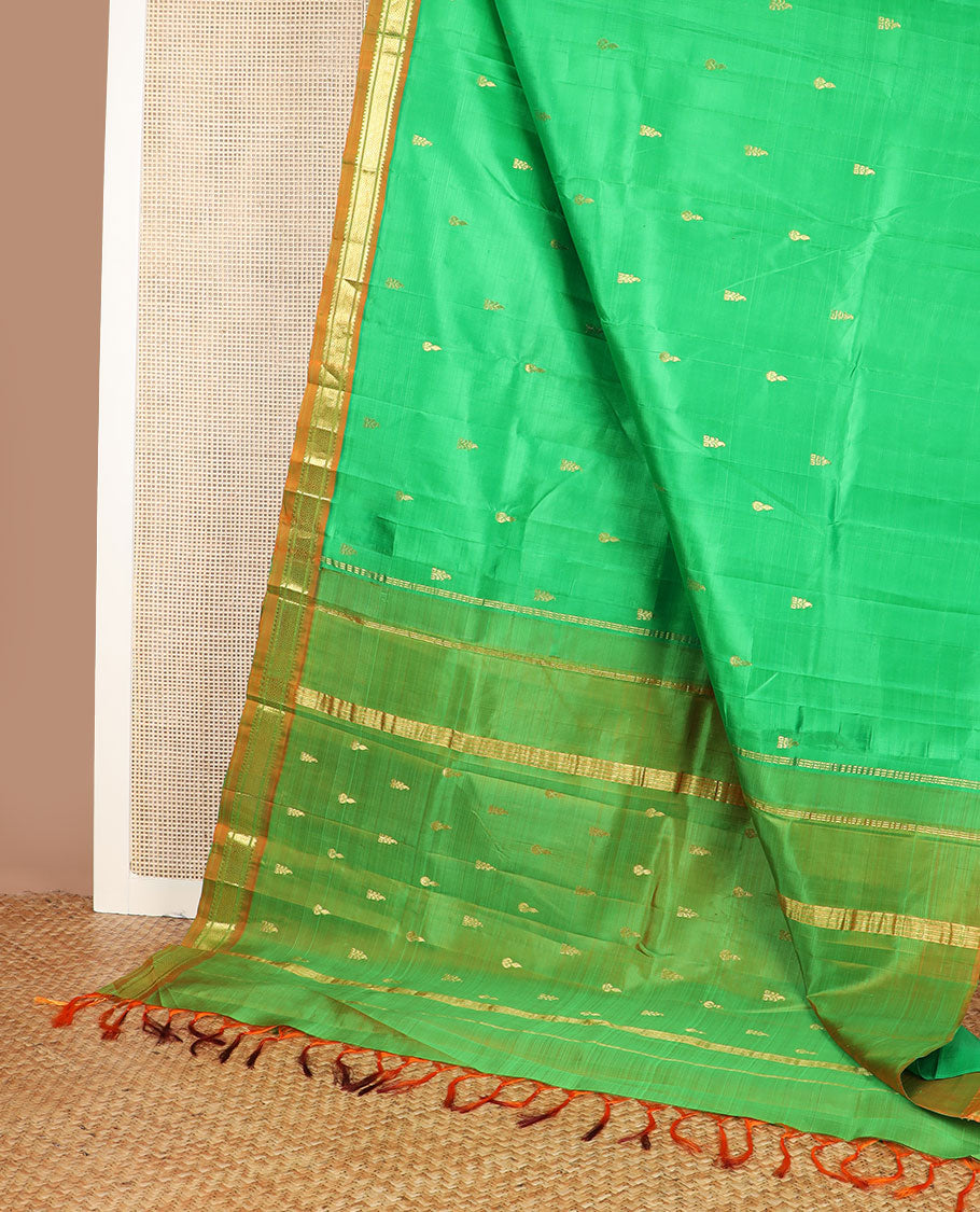 Green zari buttas kanchipuram silksaree, contrast one-sided border of thazampoo rekku,banaras & jaal design & zari design pallu