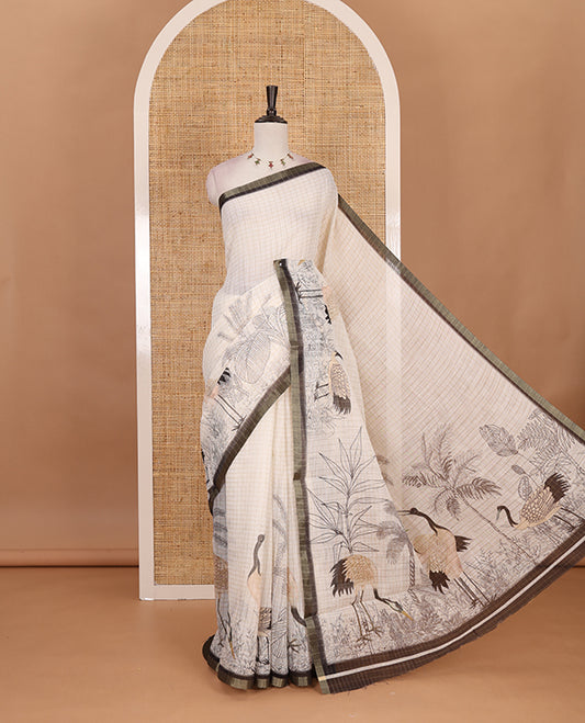 White with green zari checks linen saree with contrast border and unique designs of pallu along with contrast plain blouse