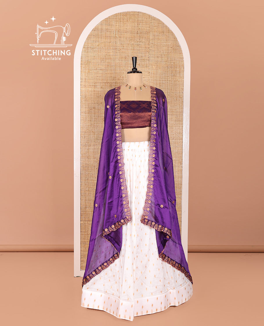 Cream and Purple Half-Saree Featuring Gold Zari Buttas Steeped Nylon Viscose Skirt, Complemented by a Contrast Jacquard Zari Design Blouse, and Comes with a Syska Georgette Embroidered Scallop-Bordered Dhavani