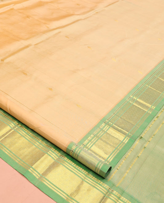Sandal Kanchipuram Silk Saree, Accentuated with Buttas, a Contrast One-Sided Border of Panner Sombu, Banaras, and Jaal Design, Zari Design Pallu, and No Blouse