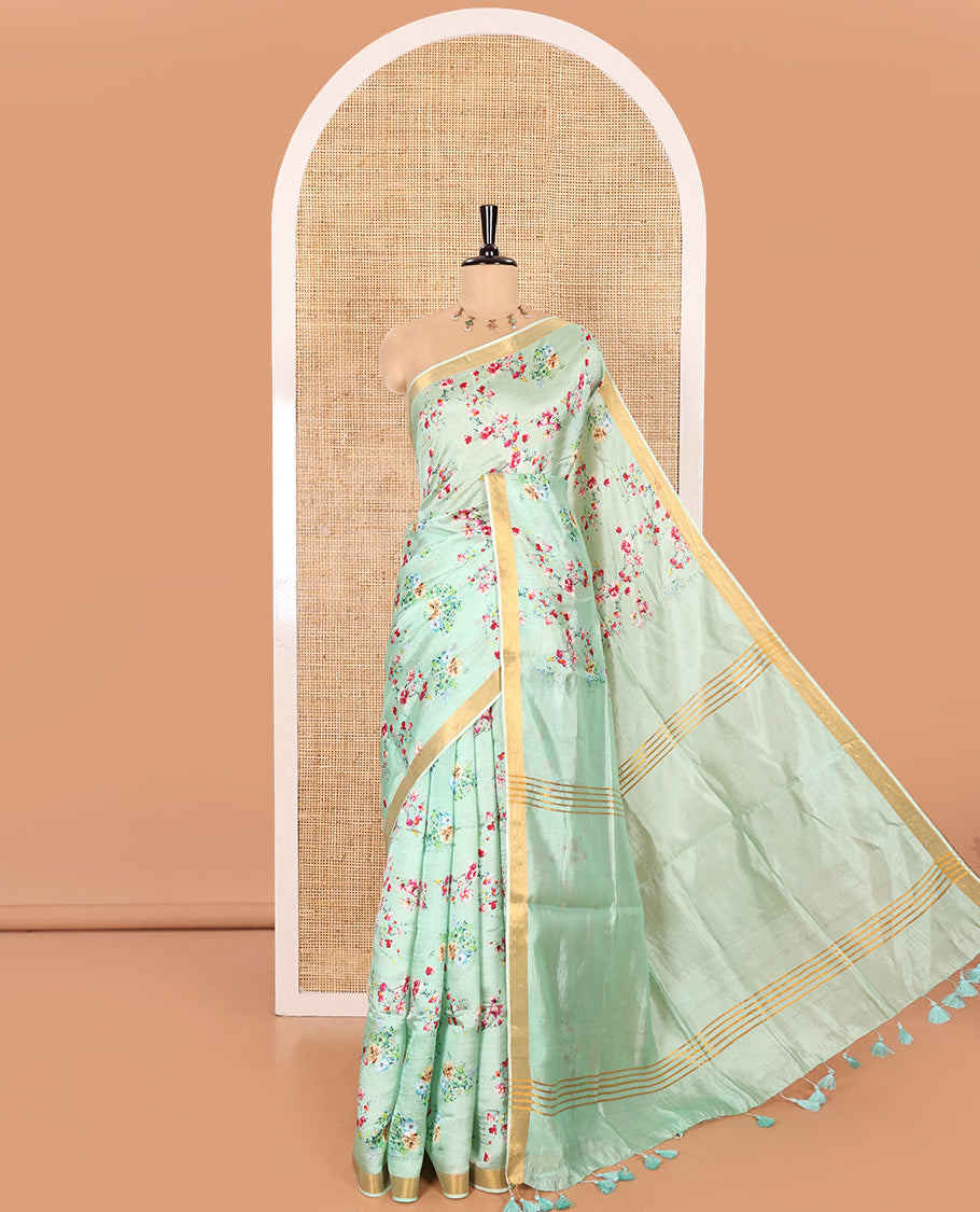 Mint Green Banana Pith Saree Prettified with Multi-Color Floral Vine Print, Subtle Small Bavanji Border, Gleaming Zari Striped Pallu, and Complemented with a Contrast Floral-Printed Blouse