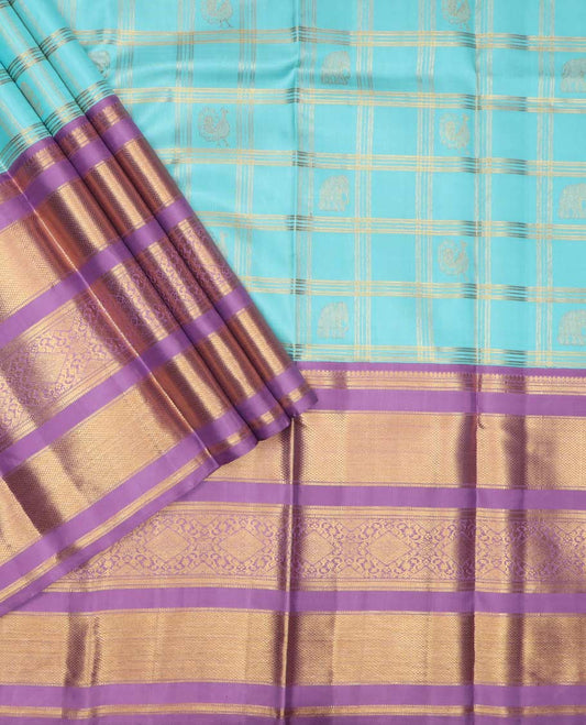 Blue puresilk halfsaree, yaanai and mayil butta enclosed checked skirt, contrast blouse and border of traditional designs in zari, and zari design dhavani