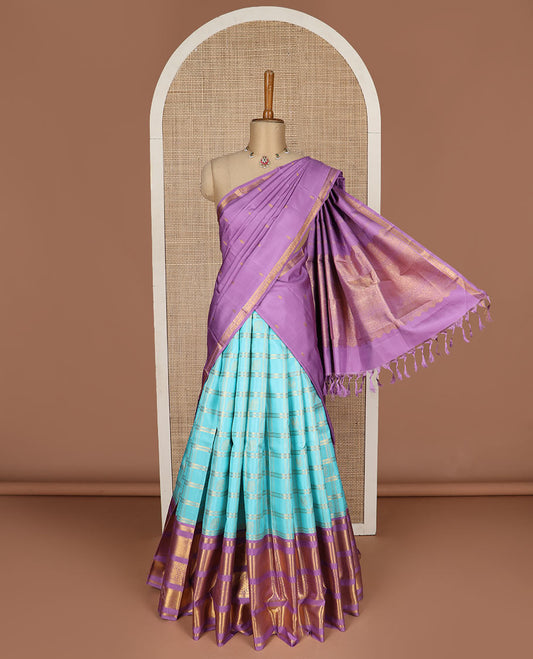 Blue puresilk halfsaree, yaanai and mayil butta enclosed checked skirt, contrast blouse and border of traditional designs in zari, and zari design dhavani