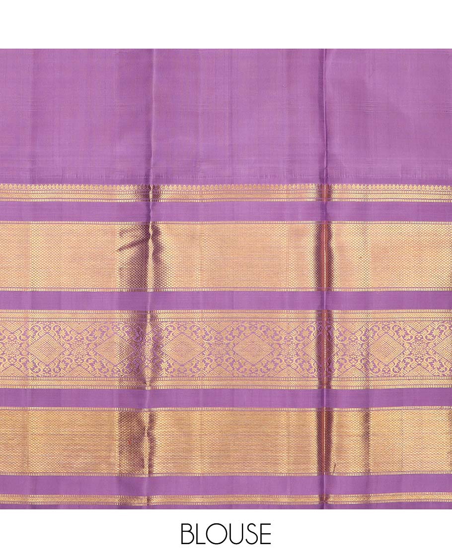 Blue puresilk halfsaree, yaanai and mayil butta enclosed checked skirt, contrast blouse and border of traditional designs in zari, and zari design dhavani