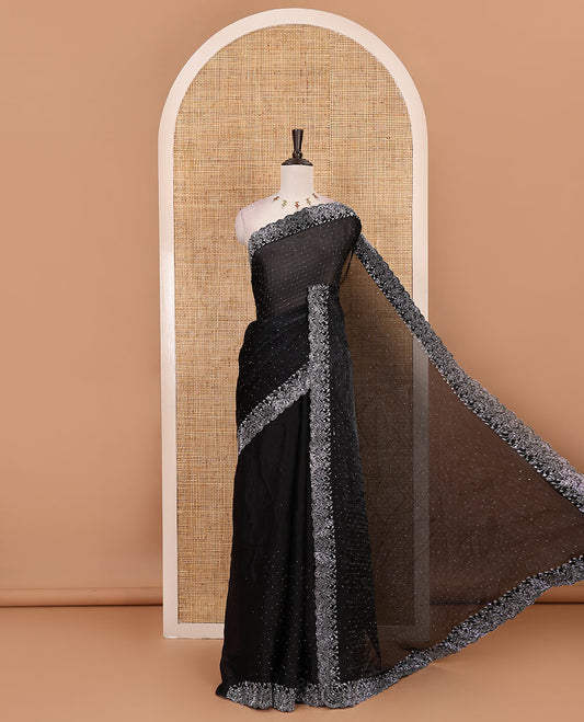 Black Swarovski crystal stone embedded fendy chiffon saree, scallop border accentuated with floral and scallop design in Swarovski stones
