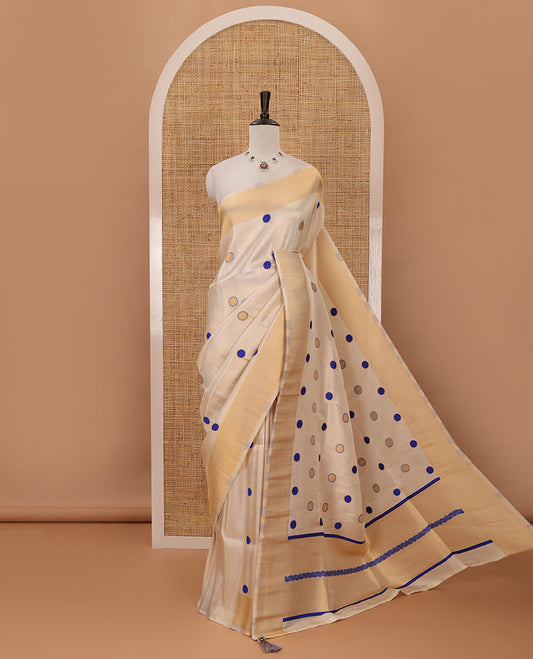 Cream small blue polka dots banarasi tissue saree, zari border, pallu of blue polka dots & running plain blouse
