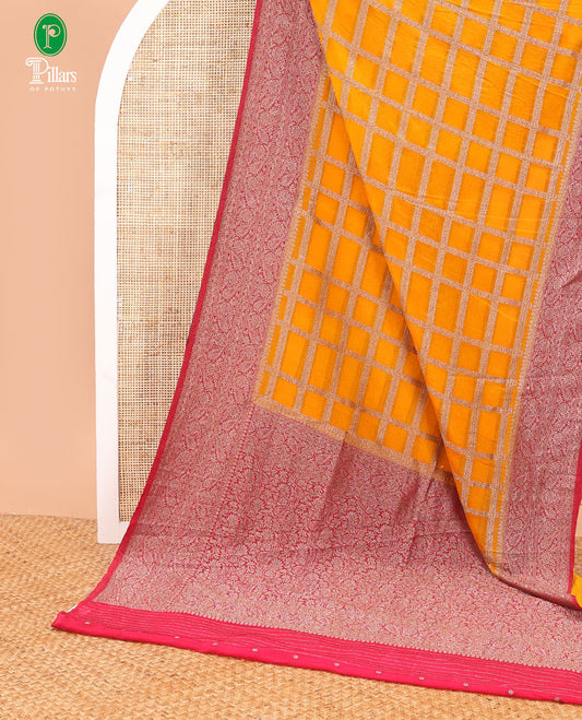 Mustard yellow rudraksh checks pattern fancy crape copper zari banaras border & rich pallu along with butta design blouse