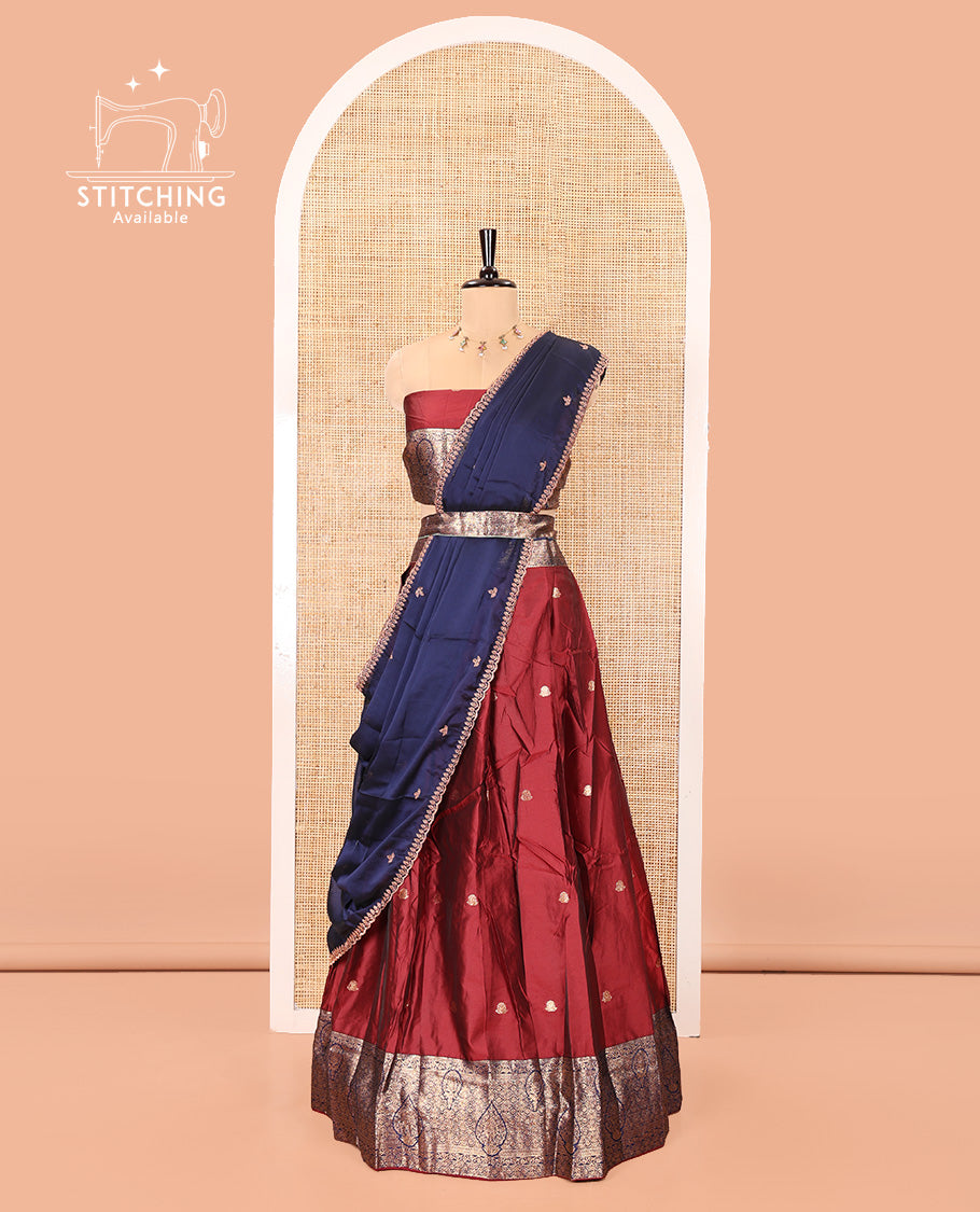 Maroon and Navy Blue Semi-Banarasi Half-Saree, Adorned with Zari Buttas on Its Skirt, Complemented by a Contrast Intricately Zari-Designed Border, Paired with a Matching Blouse, and a Contrast Satin Georgette Embroidered Scallop Dhavani