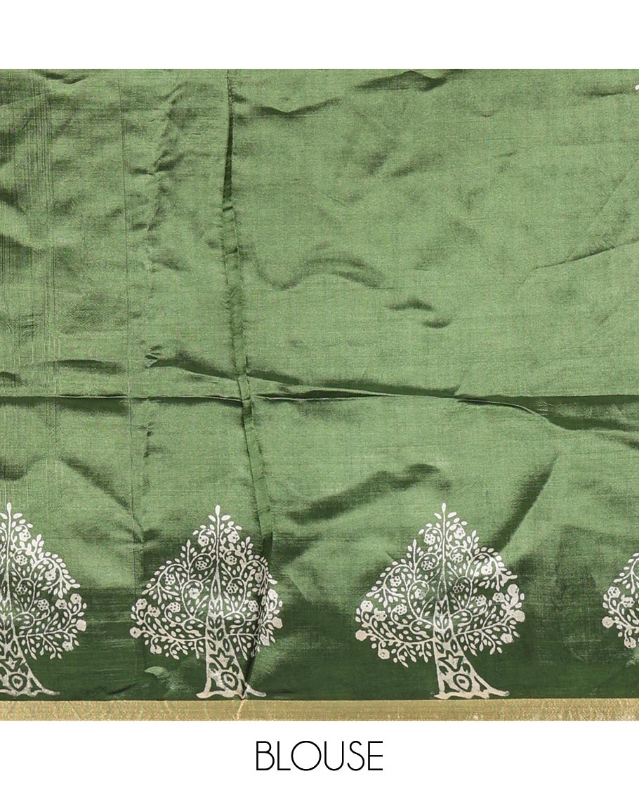 Forest green tree motifs discharge printed banana pith saree, zari piping border, floral printed pallu, and a tree discharge printed blouse