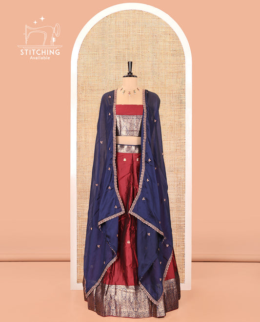 Maroon and Navy Blue Semi-Banarasi Half-Saree, Adorned with Zari Buttas on Its Skirt, Complemented by a Contrast Intricately Zari-Designed Border, Paired with a Matching Blouse, and a Contrast Satin Georgette Embroidered Scallop Dhavani