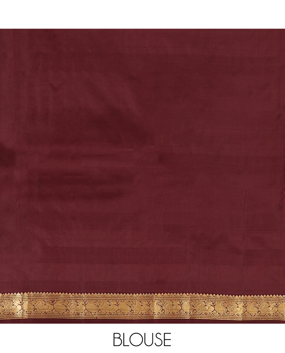 Maroon Vasundhara Silk Saree, Woven with Zari Buttas, a Zari Kaal Eragina Border of Rekku, Neli, Manga, and Mayil Designs, Grand Pallu, and a Matching Blouse