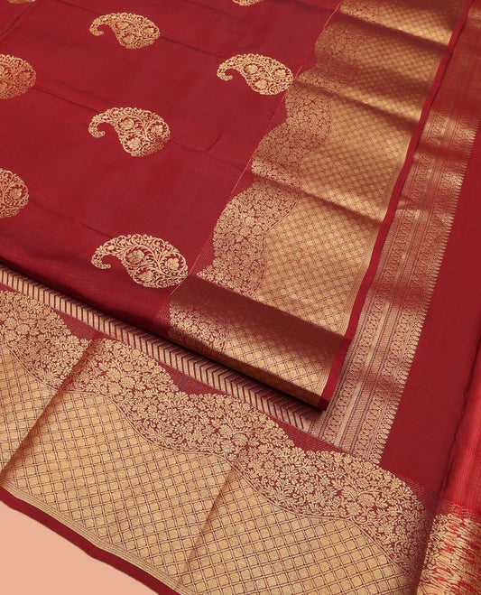 Red Vasundhara Lite Silk Mix Saree, Detailed with Zari Buttas All Over Its Body, Highlighted by a Zari Border of Floral and Jaal Designs, Pallu Steeped with Chevron Stripes, and Paired with a Matching Blouse