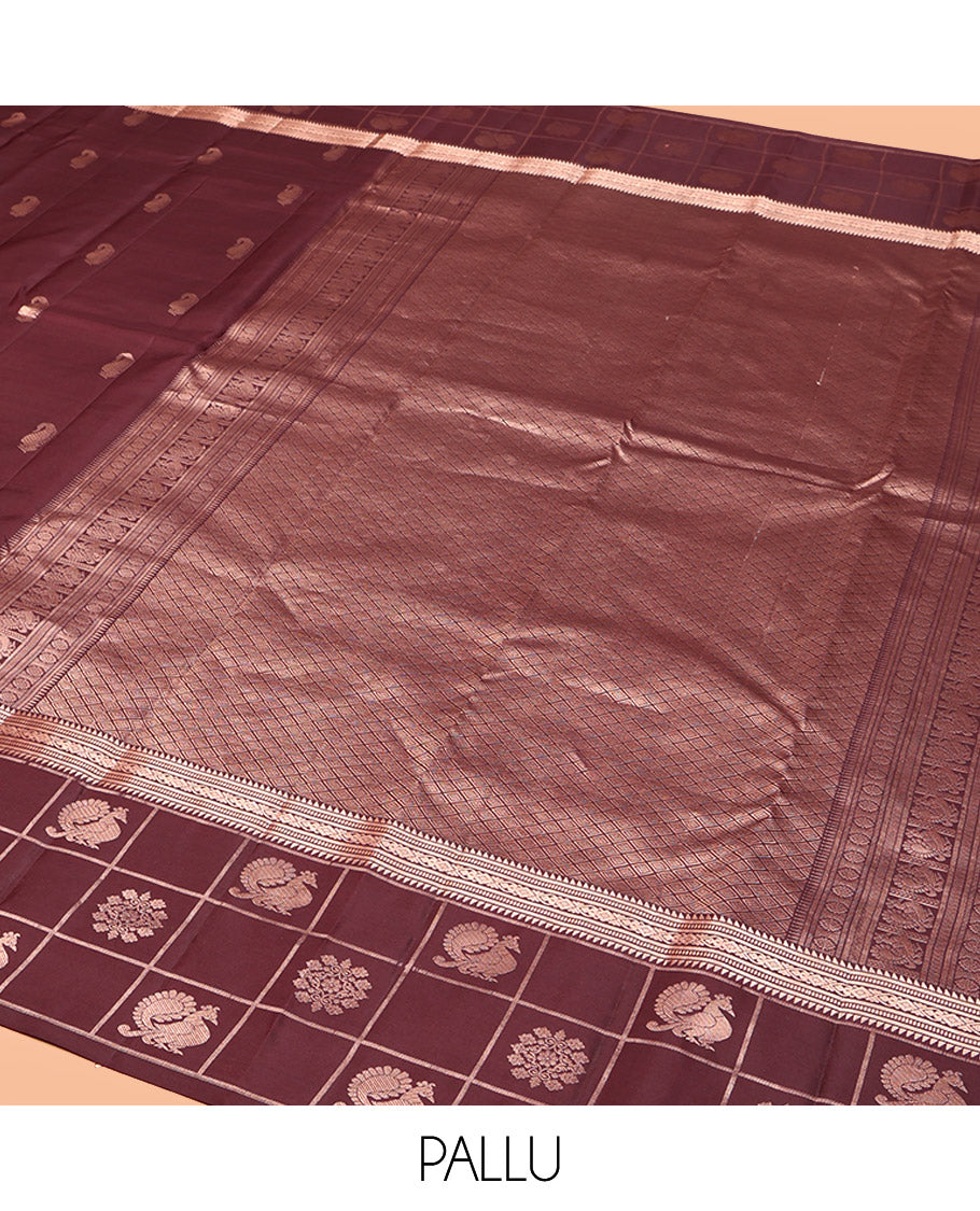 Brown Vasundhara Silk Saree, Artfully Detailed with Zari Buttas, Highlighted by a Zari Border of Rekku, Muthu, Jada Nagam, and Butta Enclosed Checks, Jaal Pallu, and a Matching Blouse