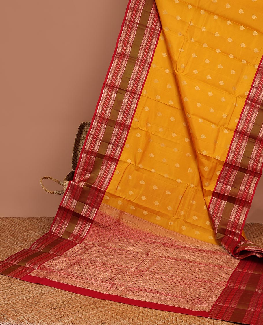 Yellow leaf buttas silk saree with contrast border of thilakam mokku, muthu, paun design & pallu of jaal design