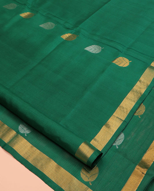 Green Uppada Silk Saree, Subtly Sparkled with Leaf Zari Buttas All Over Its Body, Subtle Bavanji Border, Pallu Steeped with Leaf Buttas, and Paired with a Matching Blouse