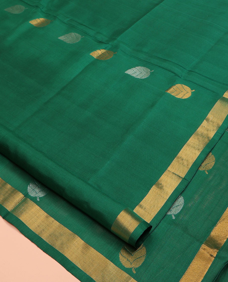Green Uppada Silk Saree, Subtly Sparkled with Leaf Zari Buttas All Over Its Body, Subtle Bavanji Border, Pallu Steeped with Leaf Buttas, and Paired with a Matching Blouse