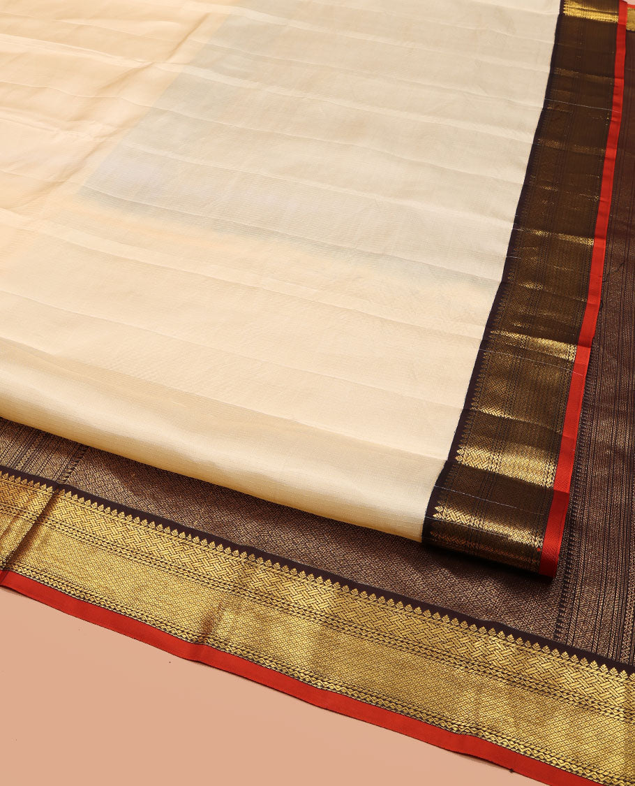 Cream Vasundhara Lite Silk Mix Saree, Sparsely Woven with Stripes on Its Body, Complemented by a Contrast Border of Thilakam, Pai Yaadi, Neli, and Mayil Kann Designs, Intricately Designed Pallu, and Paired with a Contrast Blouse