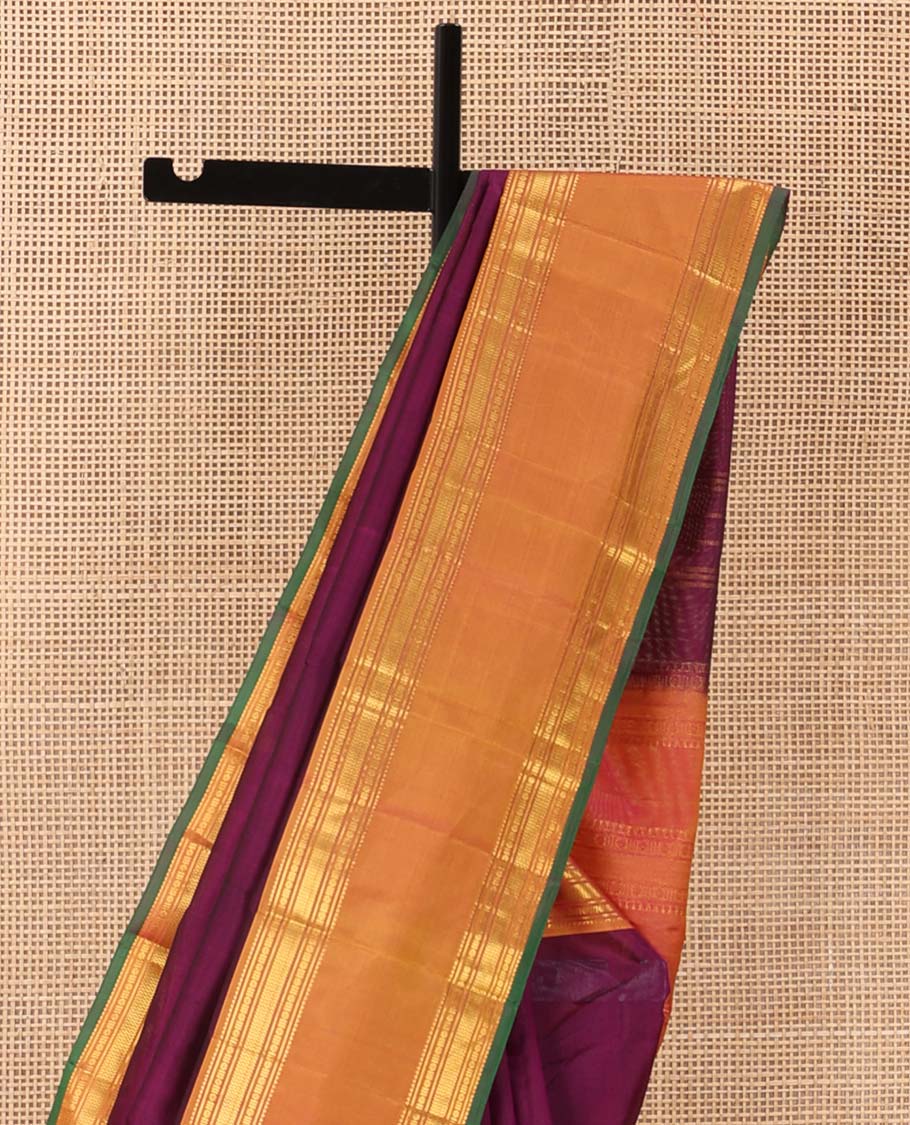 Purple plain Kanchipuram silk saree, contrast rettai pettu border of rekku, banaras, poun, and vanki designs, and zari design pallu