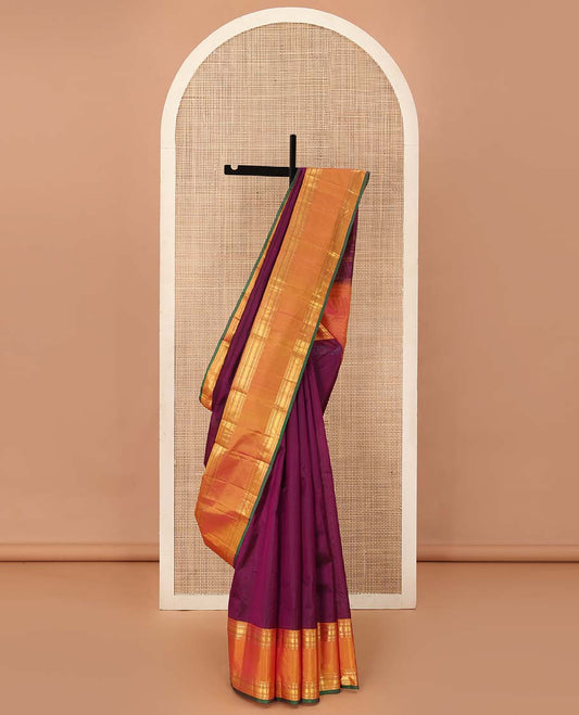 Purple plain Kanchipuram silk saree, contrast rettai pettu border of rekku, banaras, poun, and vanki designs, and zari design pallu