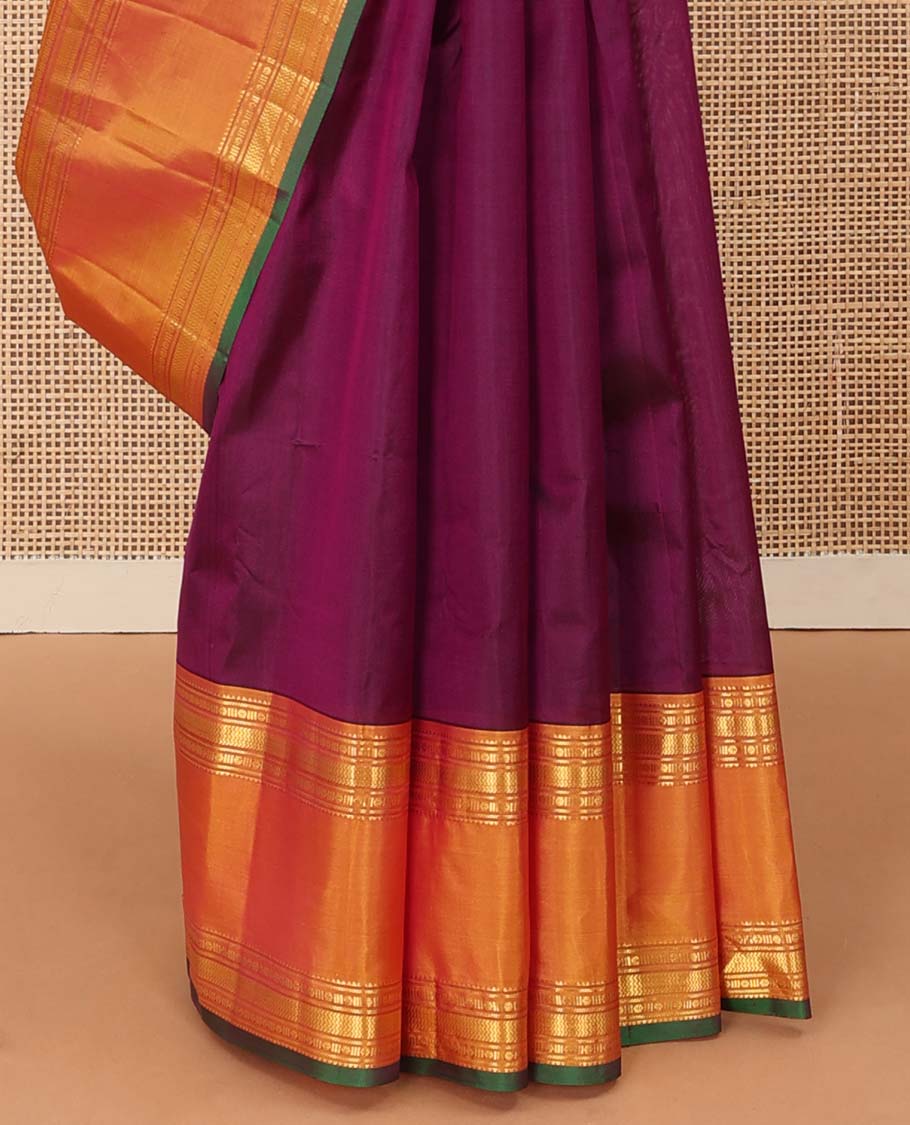 Purple plain Kanchipuram silk saree, contrast rettai pettu border of rekku, banaras, poun, and vanki designs, and zari design pallu