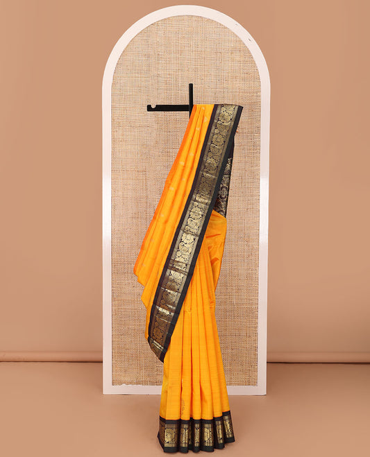 Yellow zari buttas Kanchipuram silk saree, contrast korvai one-sided border of banaras,muthu,manga & kodi visiry & floral design pallu