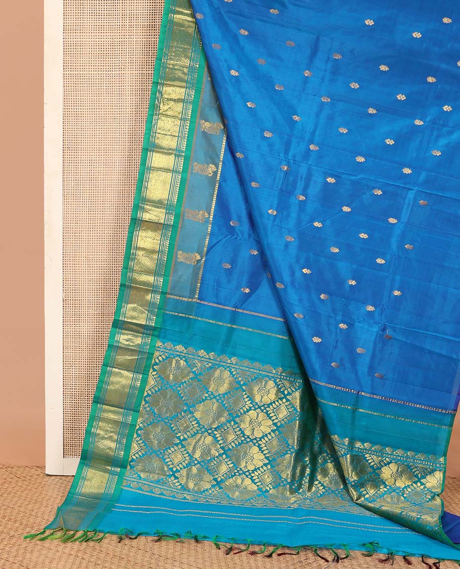 Blue zari buttas Kanchipuram silk saree, contrast one-sided border of paneer sombu, banaras, and jaal designs, and zari design pallu