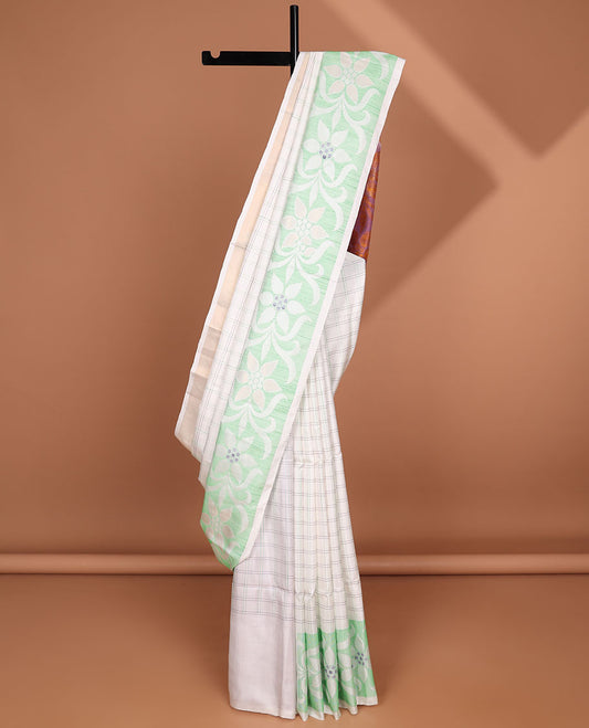 Cream-checked soft silk saree, floral ikkat design border & contrast floral design pallu