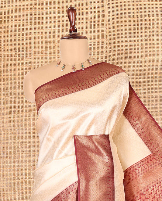 Cream-Maroon Embossed Art Kanchi Silk Saree, a Contrast Traditional Zari Border, Intricate Pallu, and a Contrast Blouse