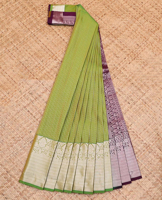 Green Budget Silk Saree, Entralled with Zari Stripes On Its Body, Highlighted by Traditional Zari Designs Woven Border, Grandly Decked Up Pallu and Paired with a Contrast Blouse