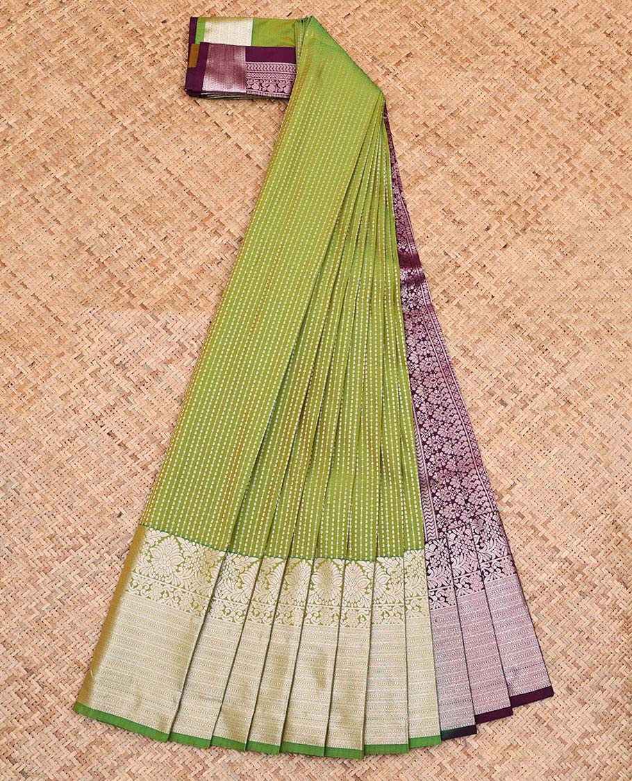 Green Budget Silk Saree, Entralled with Zari Stripes On Its Body, Highlighted by Traditional Zari Designs Woven Border, Grandly Decked Up Pallu and Paired with a Contrast Blouse