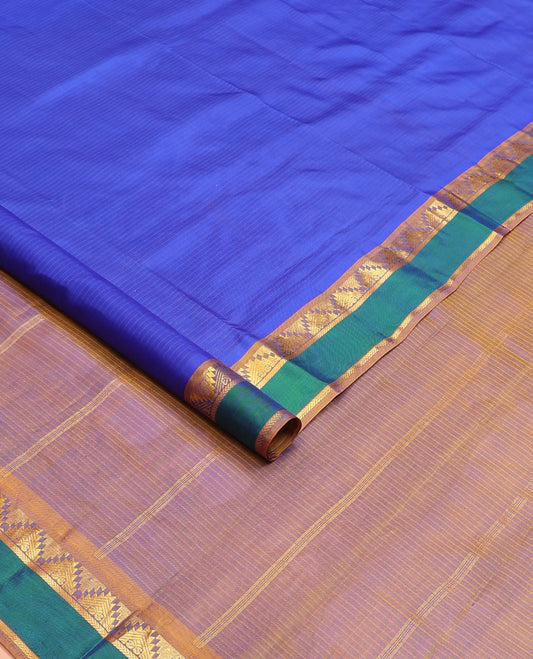 Blue striped nine-yard silk saree, contrast rettai pettu border of thazampoo rekku and kathir designs, and zari striped pallu