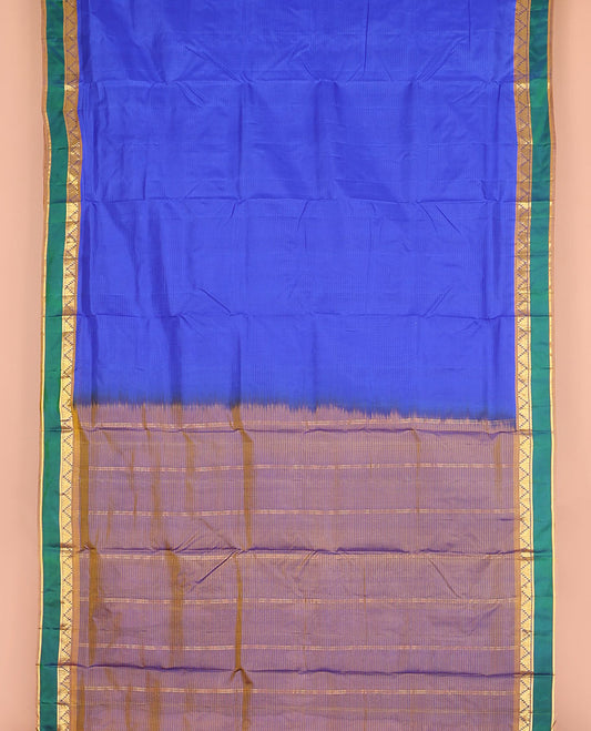 Blue striped nine-yard silk saree, contrast rettai pettu border of thazampoo rekku and kathir designs, and zari striped pallu