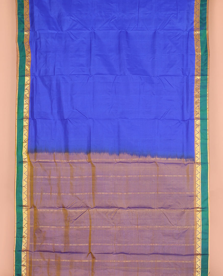 Blue striped nine-yard silk saree, contrast rettai pettu border of thazampoo rekku and kathir designs, and zari striped pallu